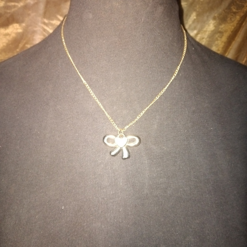 gold with silver bow pendant necklace