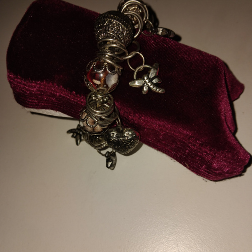 silver and orange charm bracelet