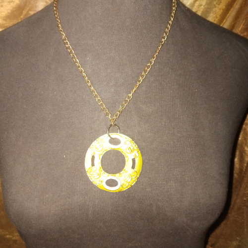 gold chain with light green disk pendant