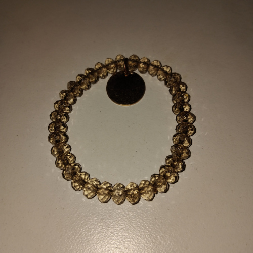 transpaent beaded with round charm bracelet