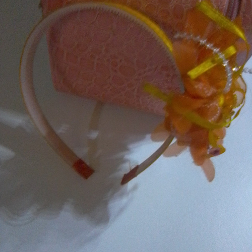 orange,yellow and blue plokadot aliceband with flower detail