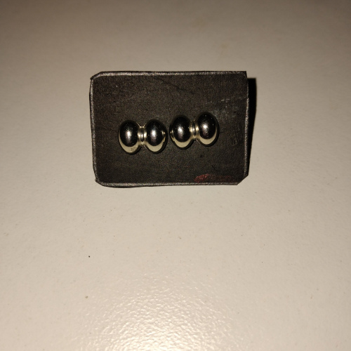silver bow shaped studs