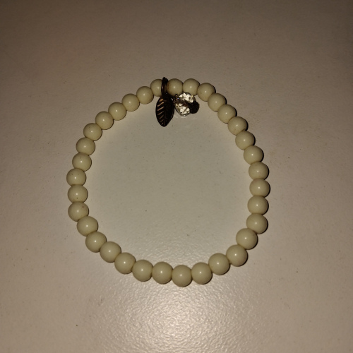 white beaded with silver charm bracelet