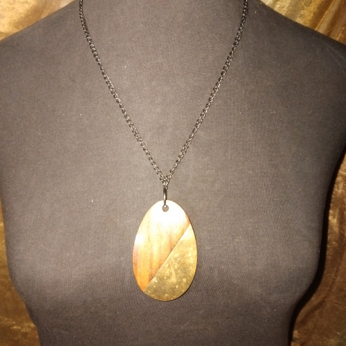 oval wooden and gold pendant chain
